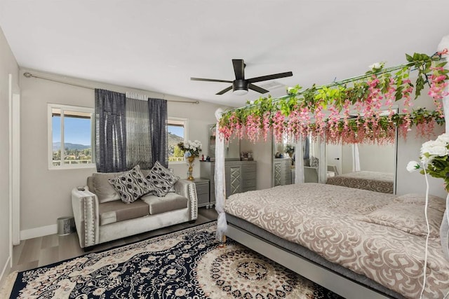 bedroom featuring hardwood / wood-style floors and ceiling fan