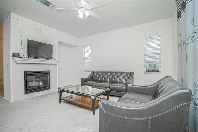 living room featuring carpet and ceiling fan