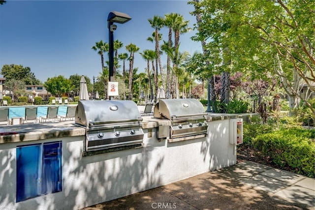 view of patio with a grill and exterior kitchen