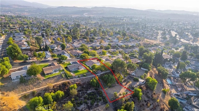 birds eye view of property featuring a mountain view