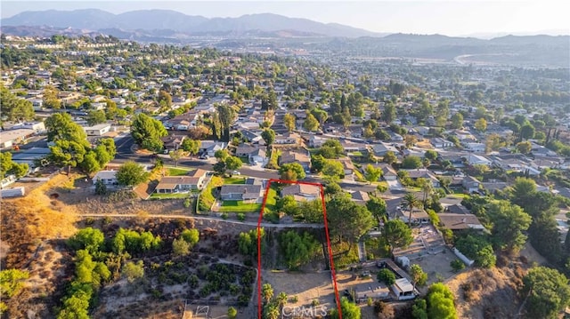 birds eye view of property featuring a mountain view