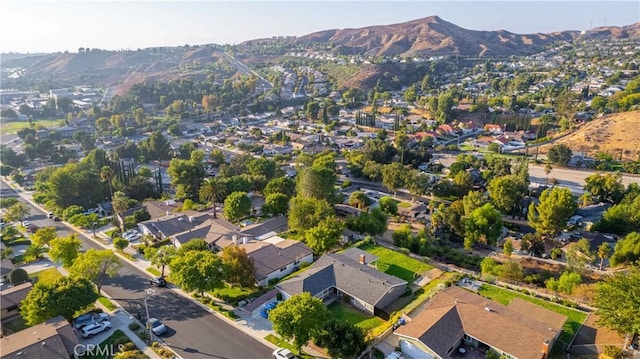 birds eye view of property with a mountain view