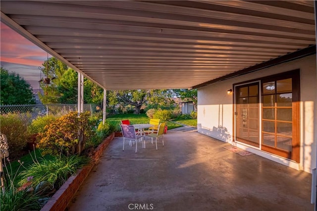 view of patio terrace at dusk