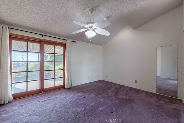 empty room featuring a textured ceiling, ceiling fan, carpet, and vaulted ceiling