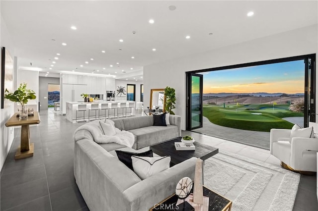 tiled living room featuring golf simulator