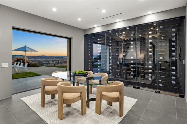 wine room featuring tile patterned flooring and recessed lighting