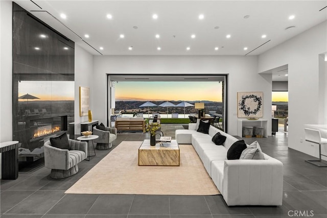 tiled living room featuring a fireplace