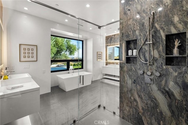 bathroom with vanity, tile patterned floors, and independent shower and bath