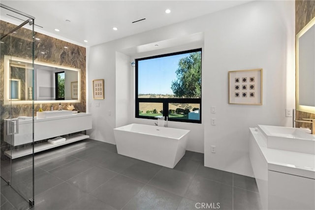 bathroom with vanity, recessed lighting, a stall shower, tile patterned flooring, and a freestanding bath