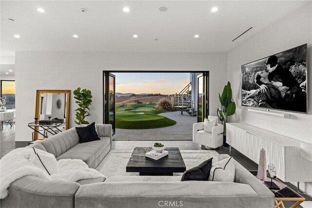 living area with plenty of natural light and recessed lighting
