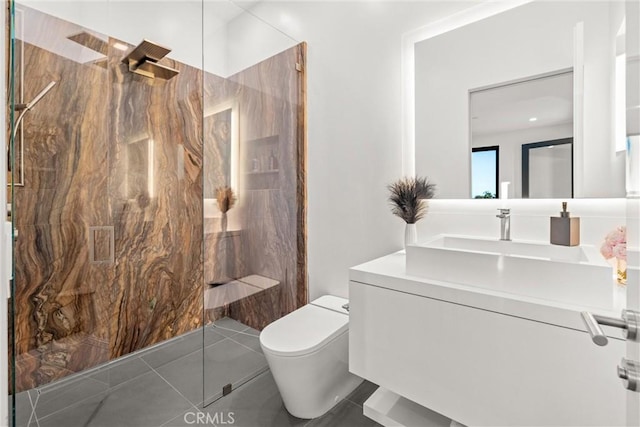 bathroom with tile patterned floors, vanity, and toilet