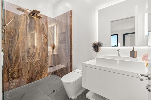 full bath featuring tile patterned floors, toilet, a marble finish shower, and vanity