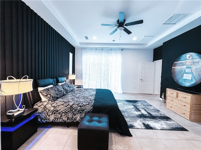 bedroom with ceiling fan and light tile patterned flooring