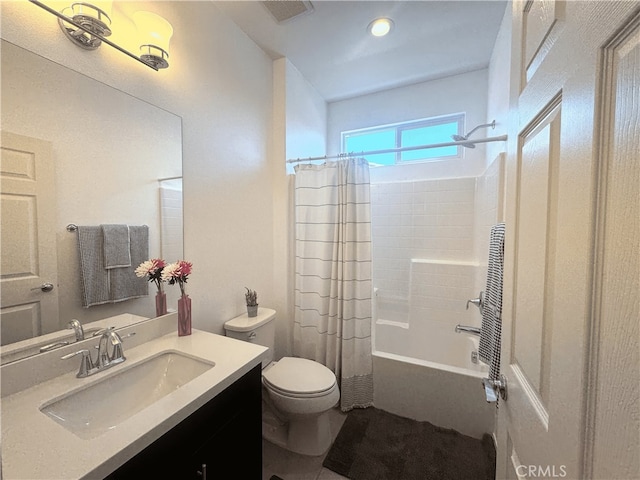 full bathroom featuring vanity, shower / tub combo, and toilet