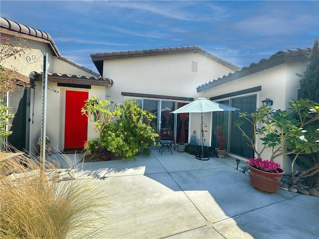 rear view of house with a patio area