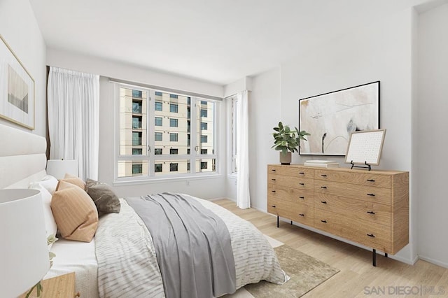 bedroom with light wood-type flooring