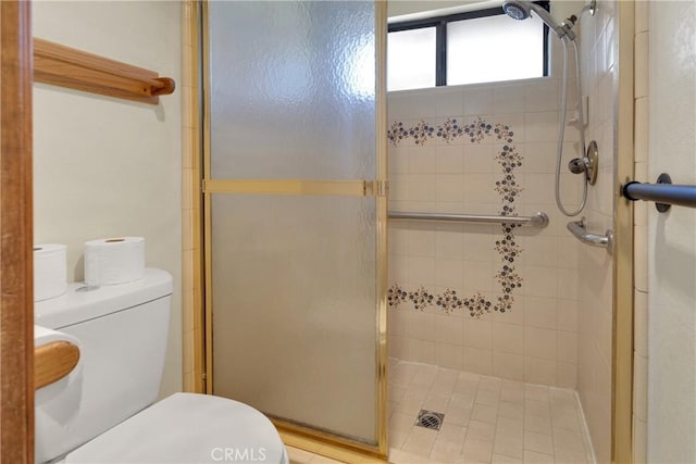 bathroom featuring toilet and walk in shower