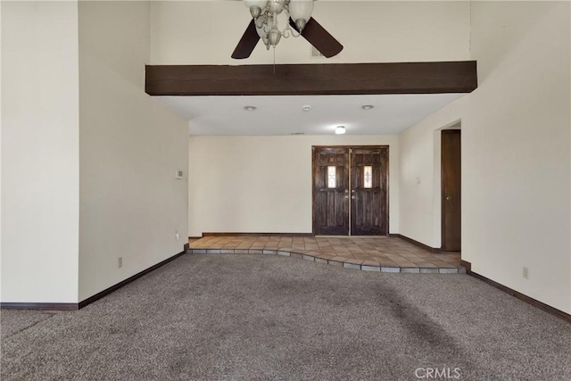 foyer featuring carpet flooring and ceiling fan