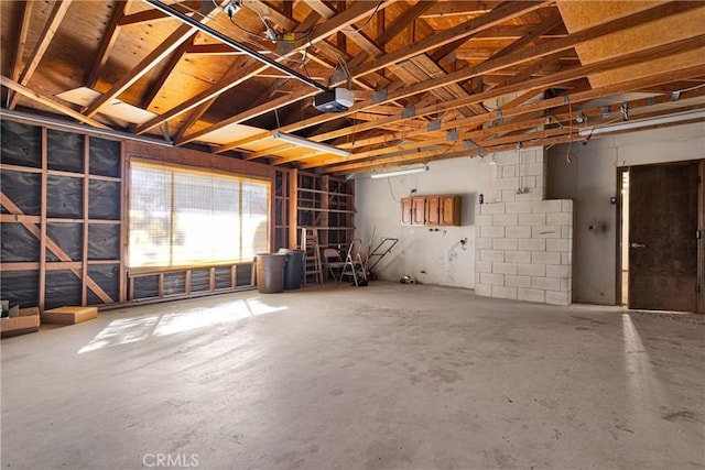 misc room featuring concrete flooring and lofted ceiling