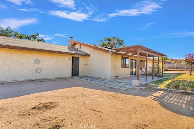 view of front of property with a patio