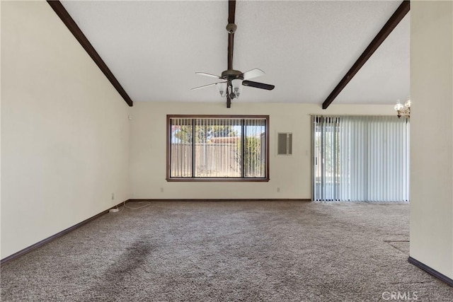 carpeted empty room featuring ceiling fan with notable chandelier and lofted ceiling with beams