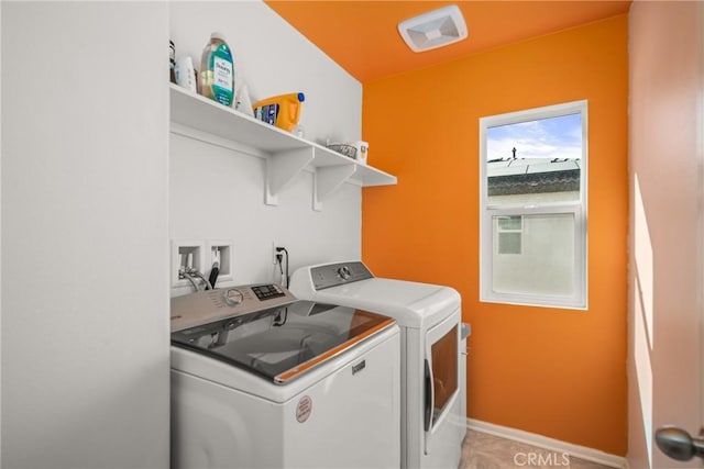 laundry room with independent washer and dryer