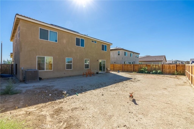 back of property with a patio