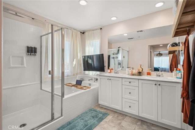 bathroom with separate shower and tub and vanity