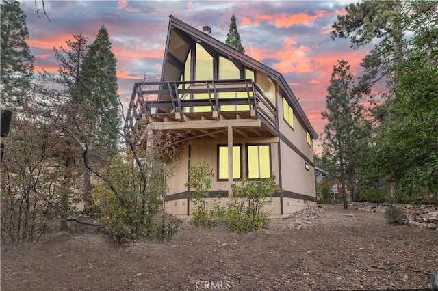 view of back house at dusk