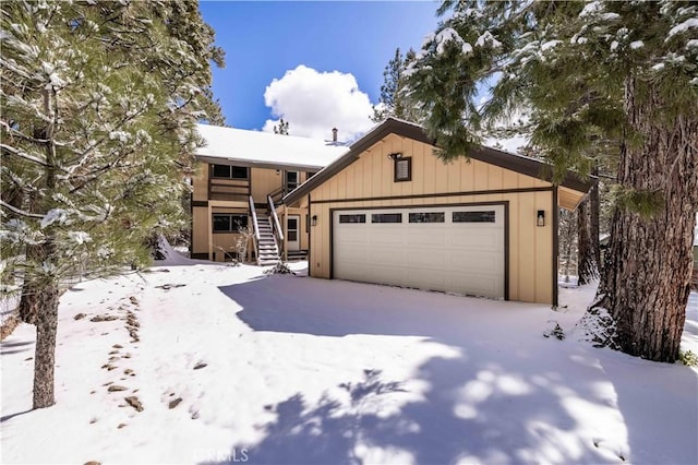 chalet / cabin with stairs and board and batten siding