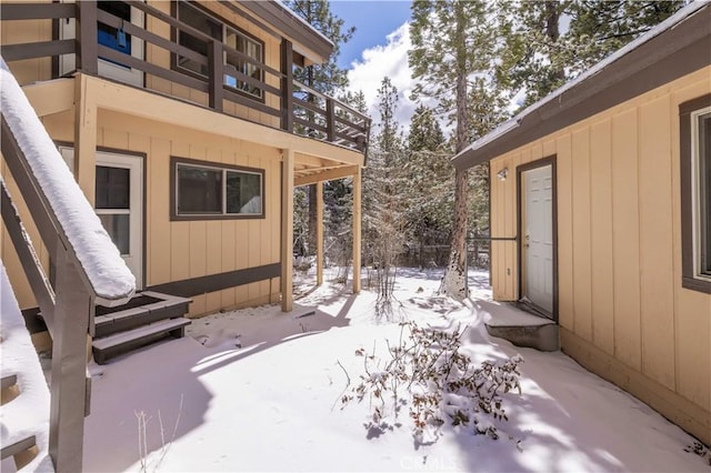 snow covered patio with entry steps