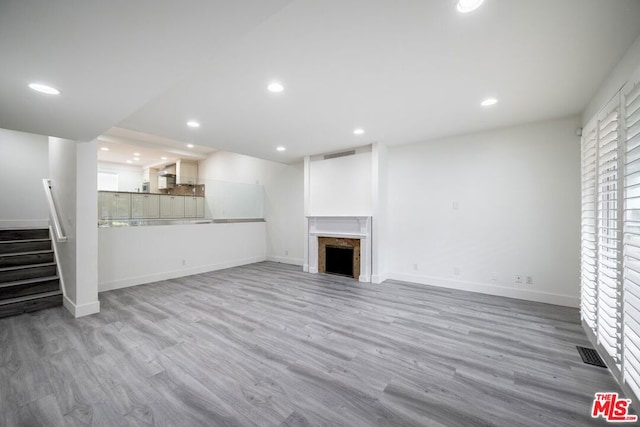 unfurnished living room featuring light hardwood / wood-style flooring