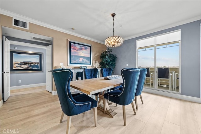 4344 Tradewinds Dr, Oxnard, CA 93035 - dining room with light wood-type flooring, ornamental molding, and baseboards