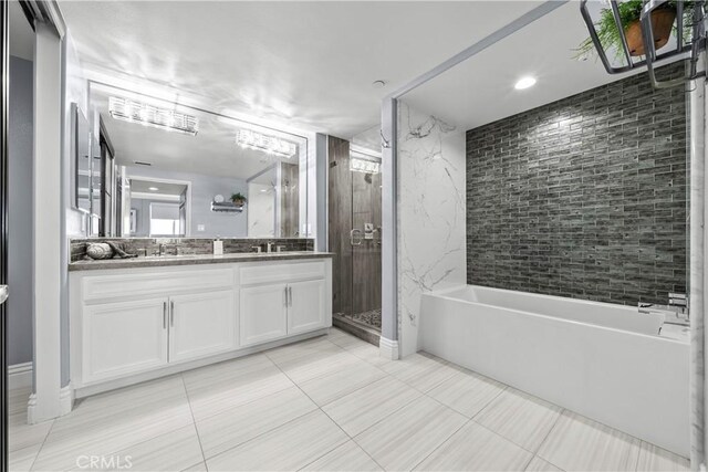 4344 Tradewinds Dr, Oxnard, CA 93035 - bathroom featuring double vanity, a stall shower, a bath, and tile patterned flooring