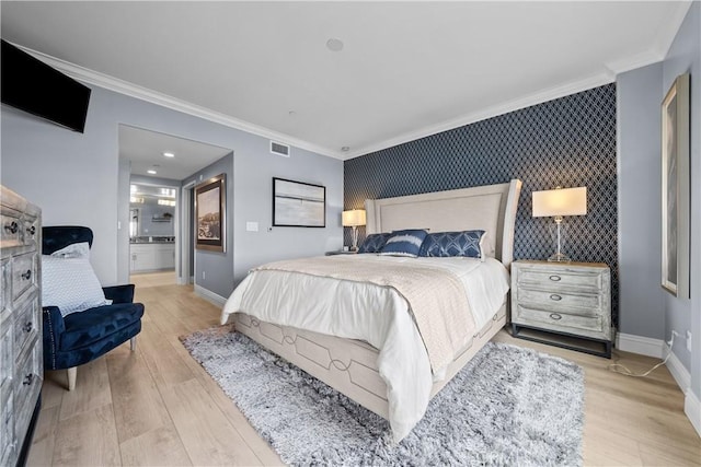 4344 Tradewinds Dr, Oxnard, CA 93035 - bedroom with an accent wall, ornamental molding, baseboards, wood finished floors, and wallpapered walls
