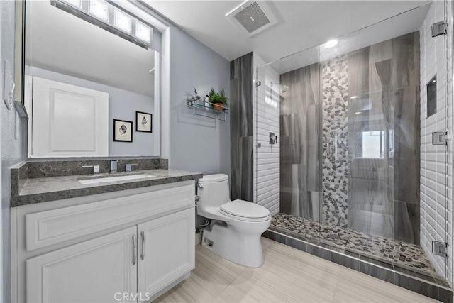 4344 Tradewinds Dr, Oxnard, CA 93035 - bathroom featuring toilet, vanity, and a shower stall