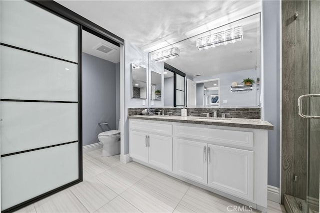 4344 Tradewinds Dr, Oxnard, CA 93035 - full bath featuring double vanity, a shower stall, backsplash, toilet, and tile patterned flooring