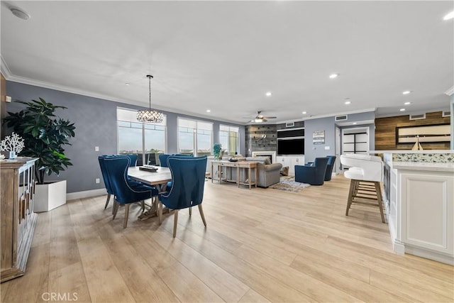4344 Tradewinds Dr, Oxnard, CA 93035 - dining room featuring ceiling fan, recessed lighting, a large fireplace, light wood-style flooring, and baseboards