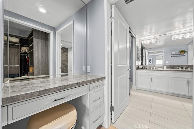 4344 Tradewinds Dr, Oxnard, CA 93035 - bathroom featuring vanity, tile patterned floors, and a spacious closet