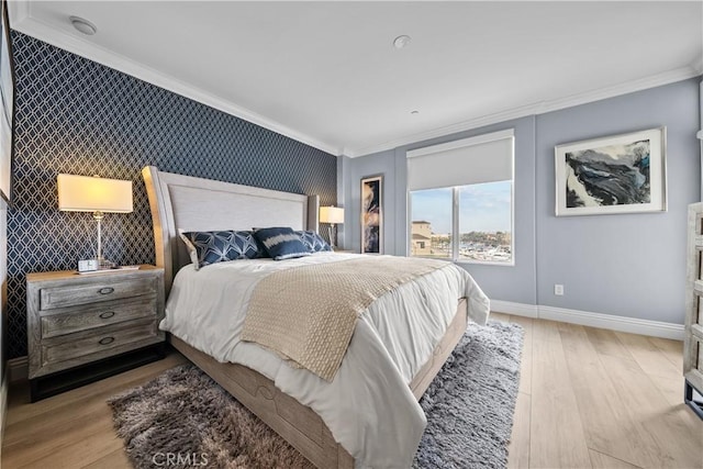 4344 Tradewinds Dr, Oxnard, CA 93035 - bedroom with an accent wall, crown molding, baseboards, and wood finished floors
