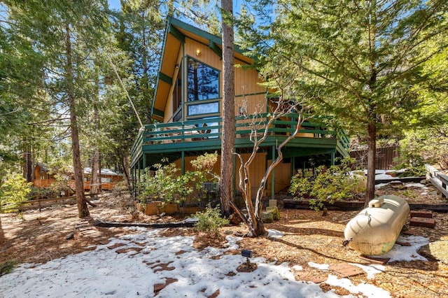 back of property with a wooden deck