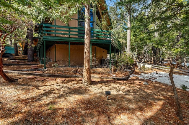 view of side of property with a deck