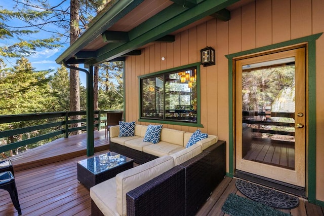 wooden deck featuring outdoor lounge area