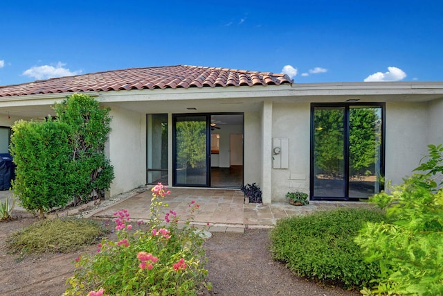 doorway to property with a patio area