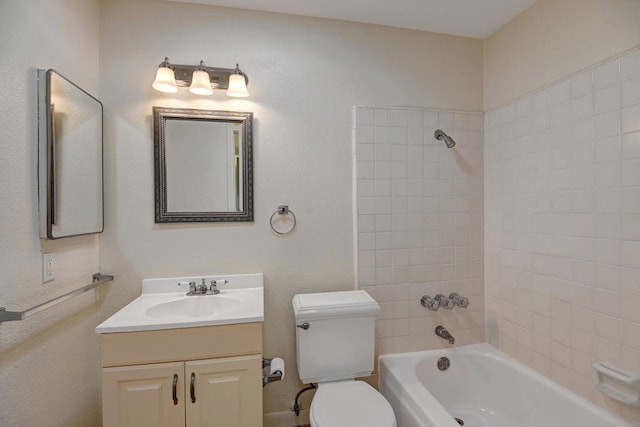 full bathroom with toilet, tiled shower / bath combo, and vanity