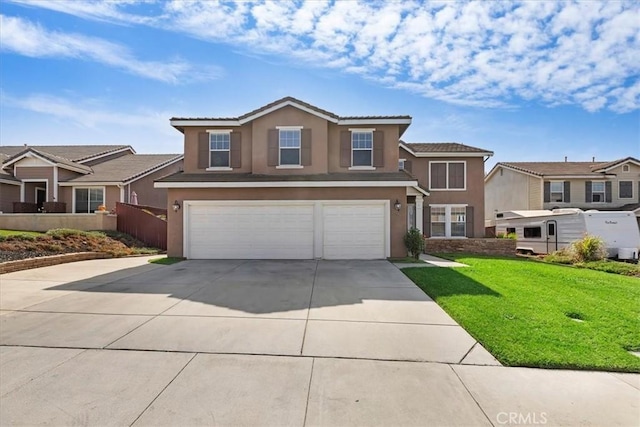 traditional-style house with a garage, a front yard, a residential view, and stucco siding