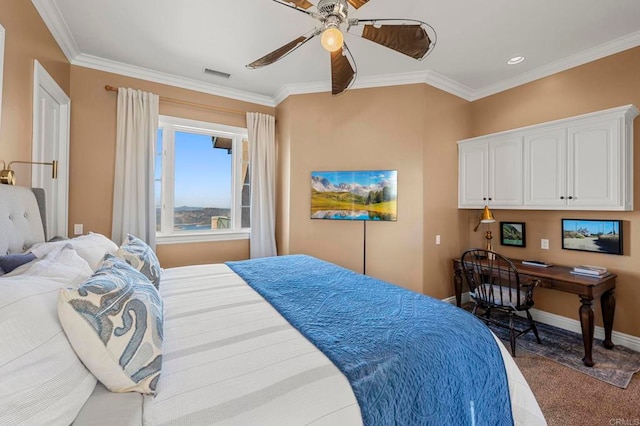 carpeted bedroom with ceiling fan and ornamental molding