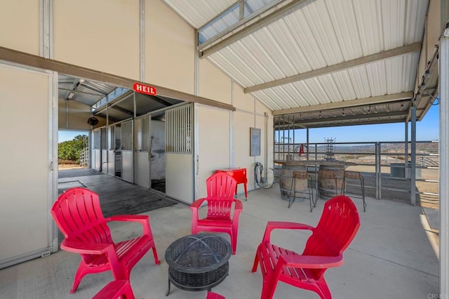 view of patio with a fire pit