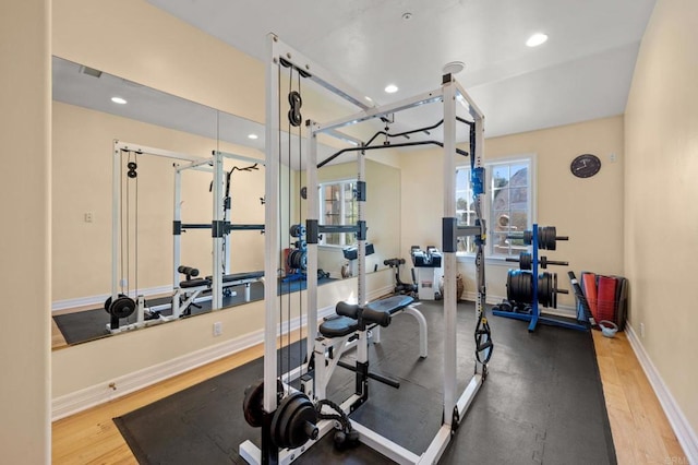 exercise area with hardwood / wood-style flooring