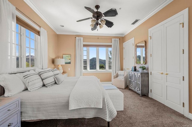 bedroom with ceiling fan, a mountain view, light colored carpet, and ornamental molding